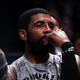 NEW YORK, NEW YORK - NOVEMBER 01: Kyrie Irving #11 of the Brooklyn Nets looks on from the bench during the second quarter of the game against the Chicago Bulls at Barclays Center on November 01, 2022, in New York City.